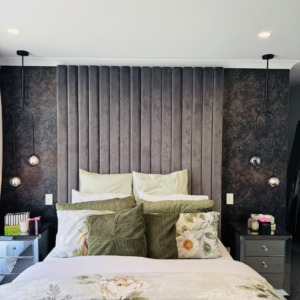 Luxury master bedroom with dark textured wallpaper